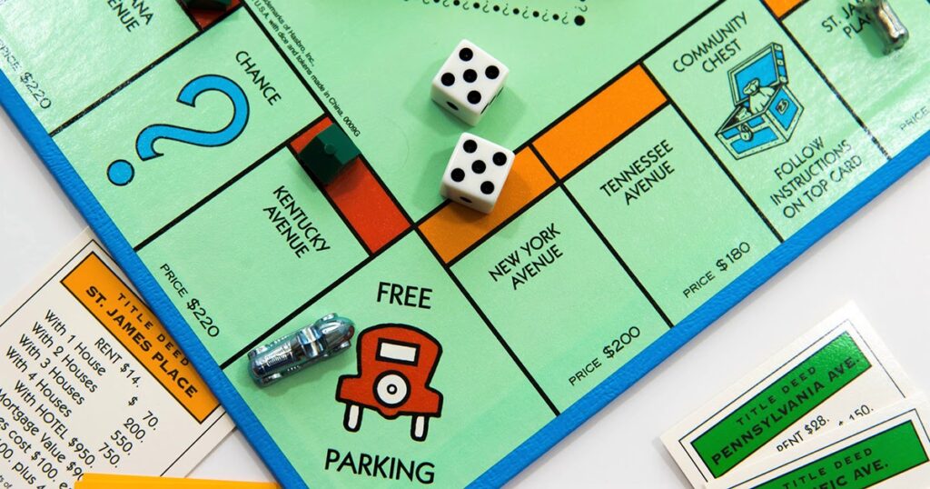 Houston, TX, USA - November 1, 2014: Monopoly board game - car on Free Parking and dice